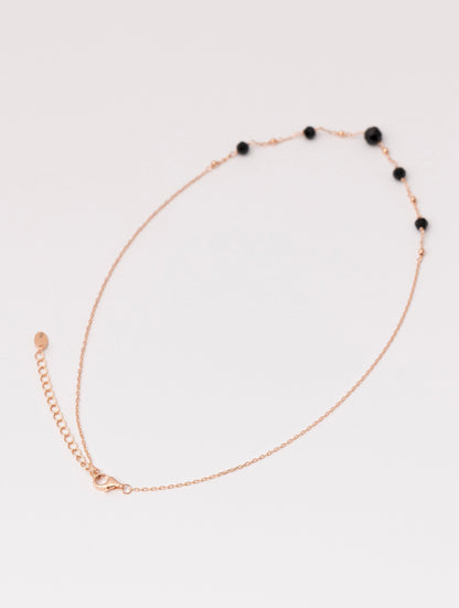 COLLAR ABBEY EN ORO ROSA Y PIEDRAS NEGRAS